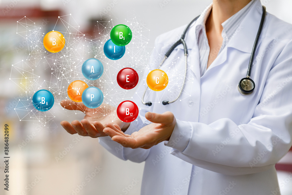 Doctor shows vitamins . Doctor shows vitamins .