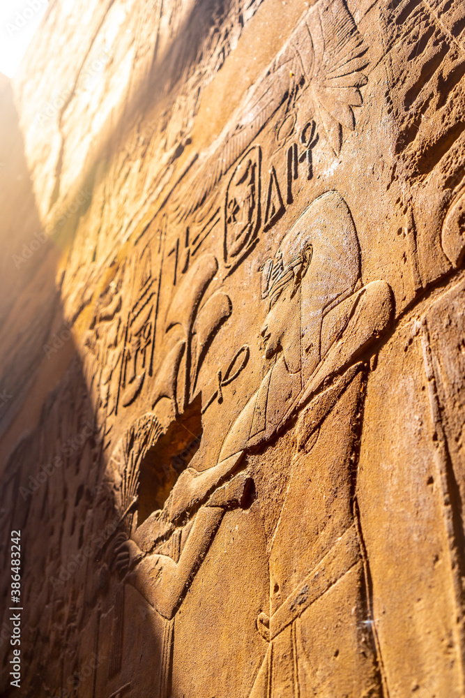 Beautiful natural light on ancient Egyptian drawings inside the Luxor Temple, Egypt