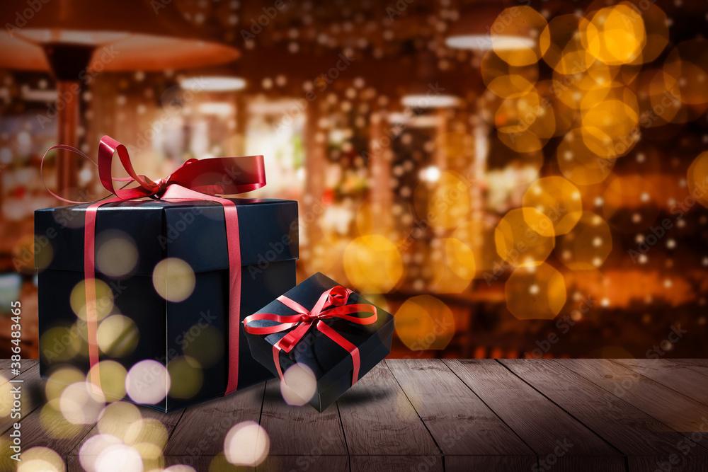 Shelf and podium with realistic black gifts boxes with gold bows. Dark background golden text lettering. Horizontal banner, poster, header website Shelf and podium with realistic black gifts boxes with gold bows. Dark background golden text lettering. Horizontal banner, poster, header website