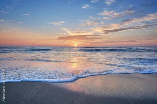 Sunset on the beach of Mar de Fora  Finisterre  Galicia  Spain. This beach is the westernmost beach in Europe  so people go there to see one of the most impressive sunsets in Northern Spain