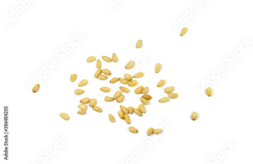 peeled pine nuts isolated on a white background 