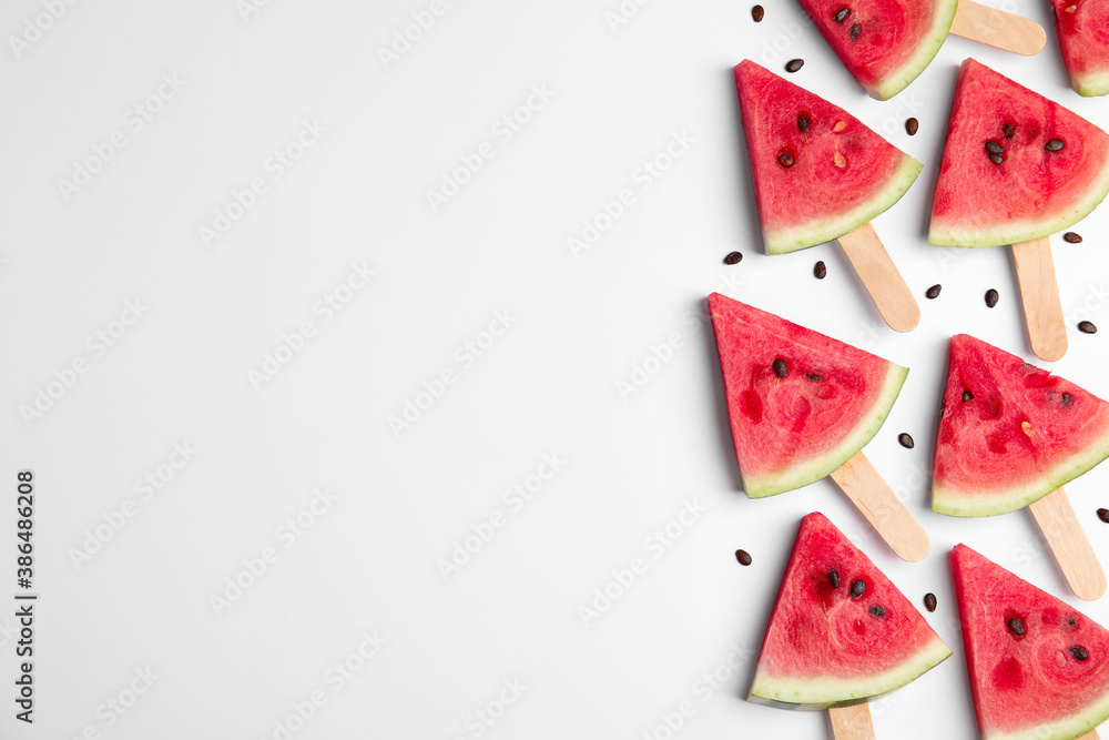 Slices of ripe watermelon on white background, flat lay. Space for text Slices of ripe watermelon on white background, flat lay. Space for text