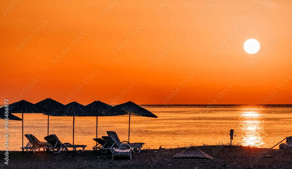 Beach umbrellas at sunrise