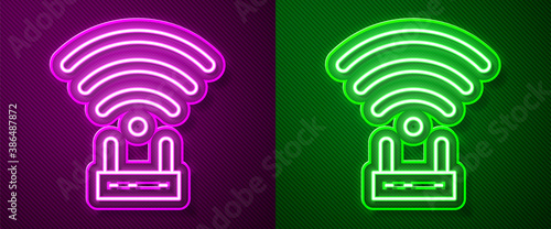 Glowing neon line Router and wi-fi signal icon isolated on purple and green background. Wireless ethernet modem router. Computer technology internet. Vector.