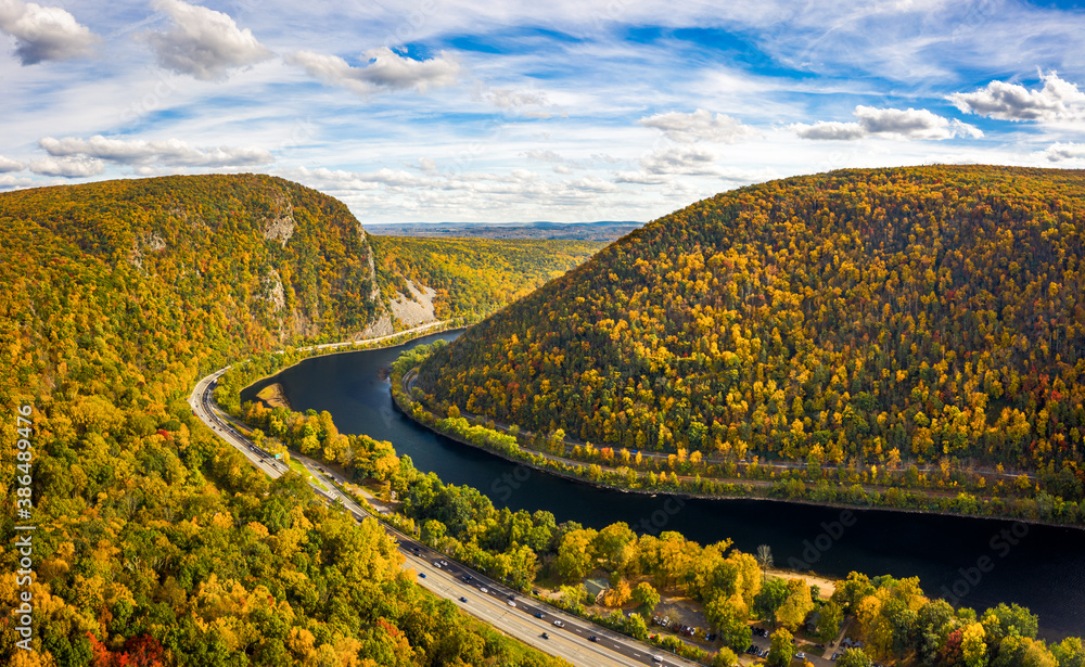 Aerial view of Delaware Water Gap on a sunny autumn day with forward camera motion. The Delaware Water Gap is a water gap on the border of the U.S. states of New Jersey and Pennsylvania