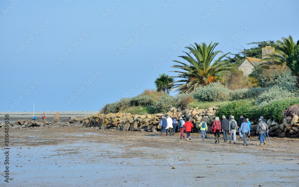 Group of retired hikers on a path in Brittany. France