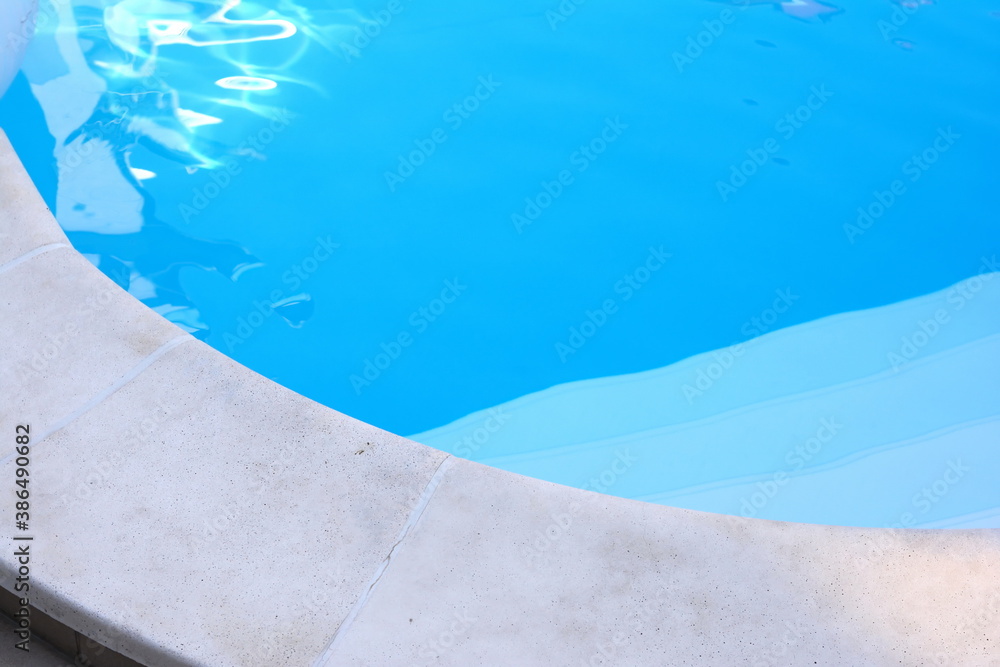 Little pool in the hotel. Surface of blue swimming pool,background of water in swimming pool. Water background blue.