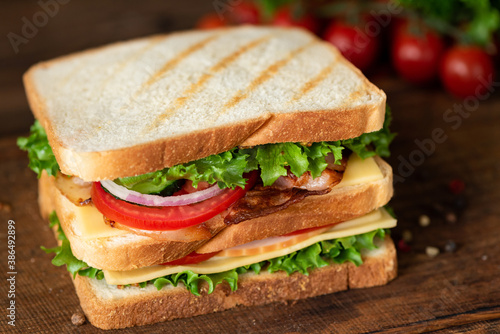 Club Sandwich with bacon cheese tomato lettuce