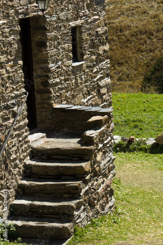 entrance and stone stairs of old village house