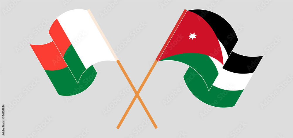 Crossed and waving flags of Madagascar and Jordan Crossed and waving flags of Madagascar and Jordan