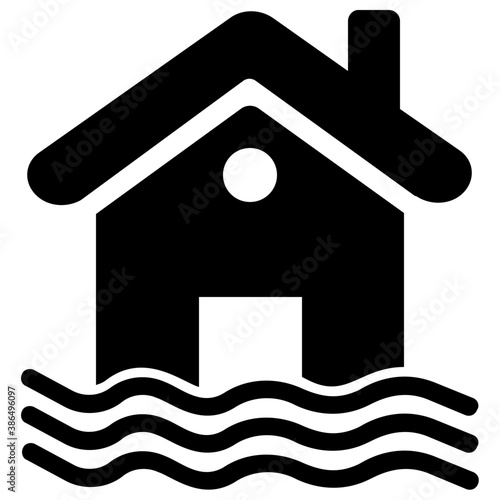 
A house building surrounded by water denoting it as flooded house 
