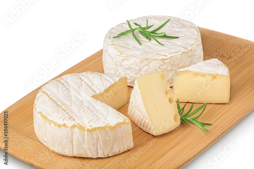 Camembert cheese on wooden board isolated on white background with clipping path and full depth of field. Top view. Flat lay