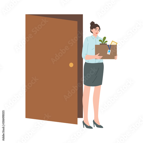 Stressed frustrated fired woman office worker carrying box of belongings
