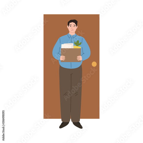 Stressed frustrated fired man office worker standing holding box of work things