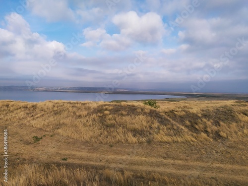 Fototapeta Naklejka Na Ścianę i Meble -  Field and hills at the coast