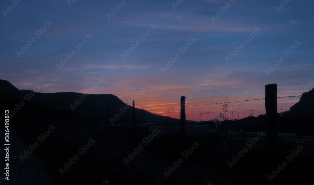 view of the sunset with mountains