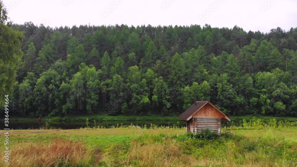 Russian nature with a wooden bath by the river. Russian nature with a wooden bath by the river.