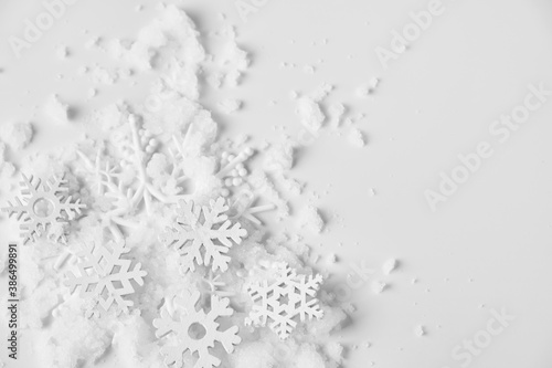 Christmas background with made of snowflakes on pastel gray background.