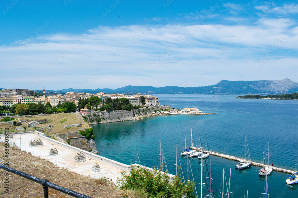 A view of Corfu town city center on the left and Mount Pantokrator, the highest peak of Corfu island, on the right, as seen from the Old Venetian Fortress