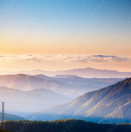Vivid mountain range with visible silhouettes. Location place Carpathian mountains, Ukraine.