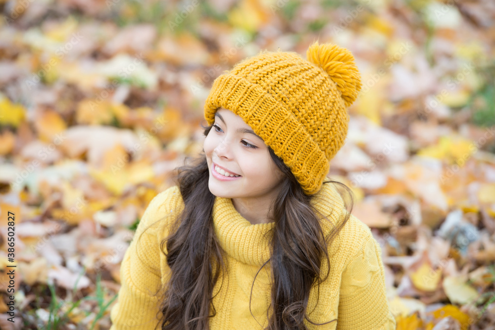 happy child in casual style spend time in autumn park enjoying good weather wearing knitted hat and warm sweater, fashion happy child in casual style spend time in autumn park enjoying good weather wearing knitted hat and warm sweater, fashion