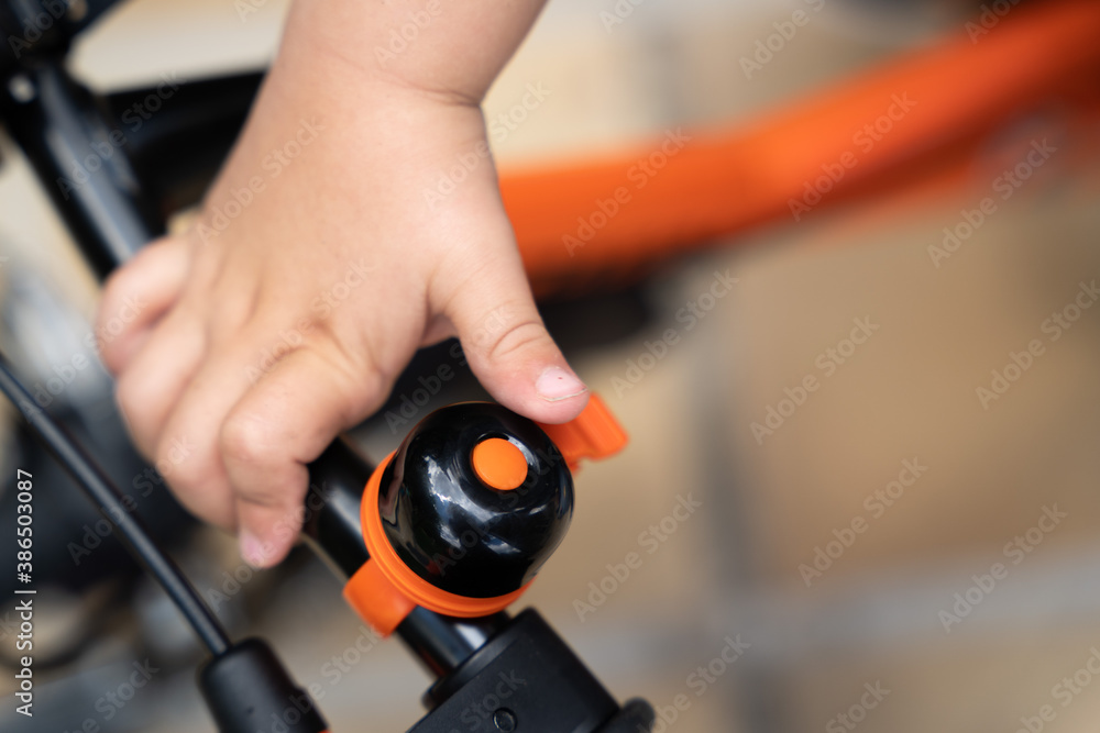 Kid ringing a bike bell