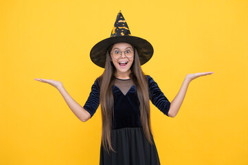 what a surprise. carnival costume party. trick or treat. celebrate the holidays. wizardry. halloween witch girl. happy childhood. teenage child in witch hat and glasses. cheerful kid create miracles