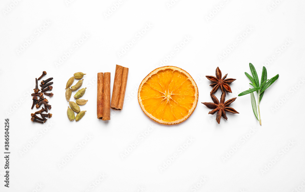 Different mulled wine ingredients on white background, flat lay - obrazy, fototapety, plakaty 