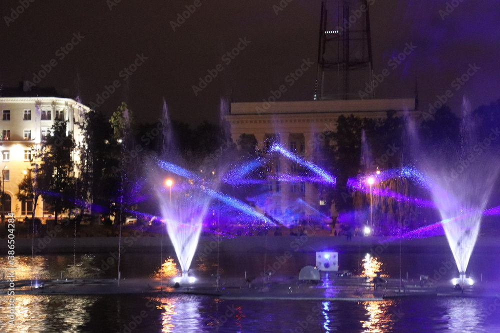 Minsk Day celebration with bright firework in river