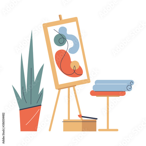 Easel with artwork and painting equipment for drawing in art studio