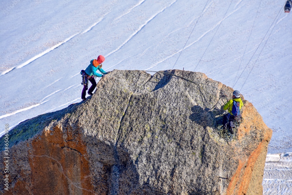 two climbers who have reached a summit.