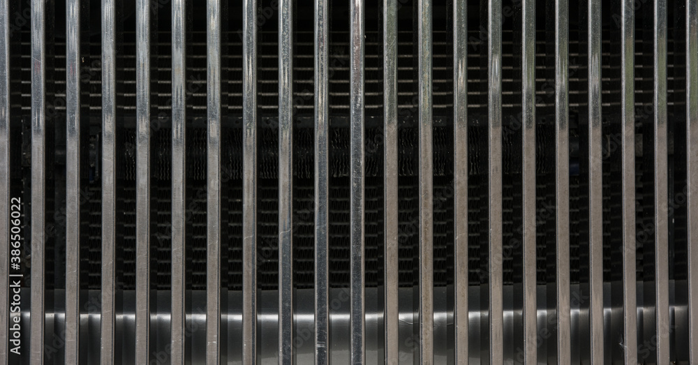 Radiator or a coolant from a car or powerplant or an engine as a background Radiator or a coolant from a car or powerplant or an engine as a background
