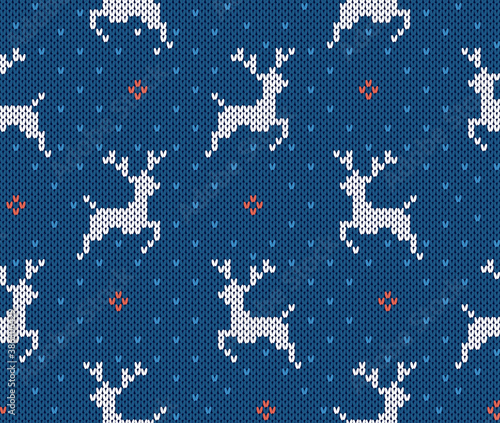 Knit christmas pattern with deers. Xmas seamless background. Vector. Knitted sweater texture. Holiday winter blue print. Festive traditional ornament with reindeer. Wool scandinavian illustration.
