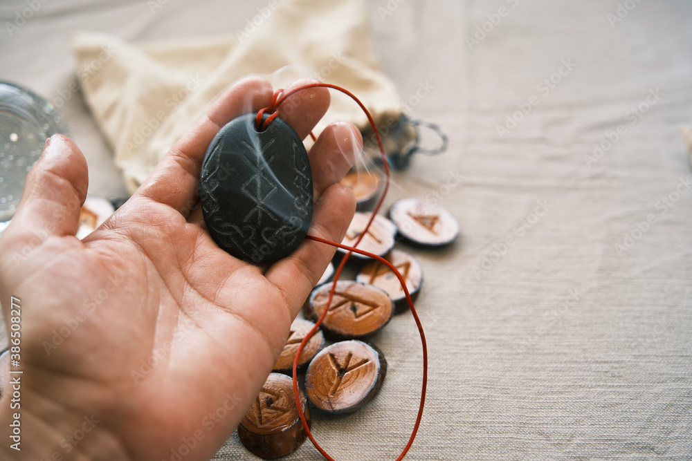 Riches Runes rune stone good luck and riches talisman with runescript Stock Photo ...