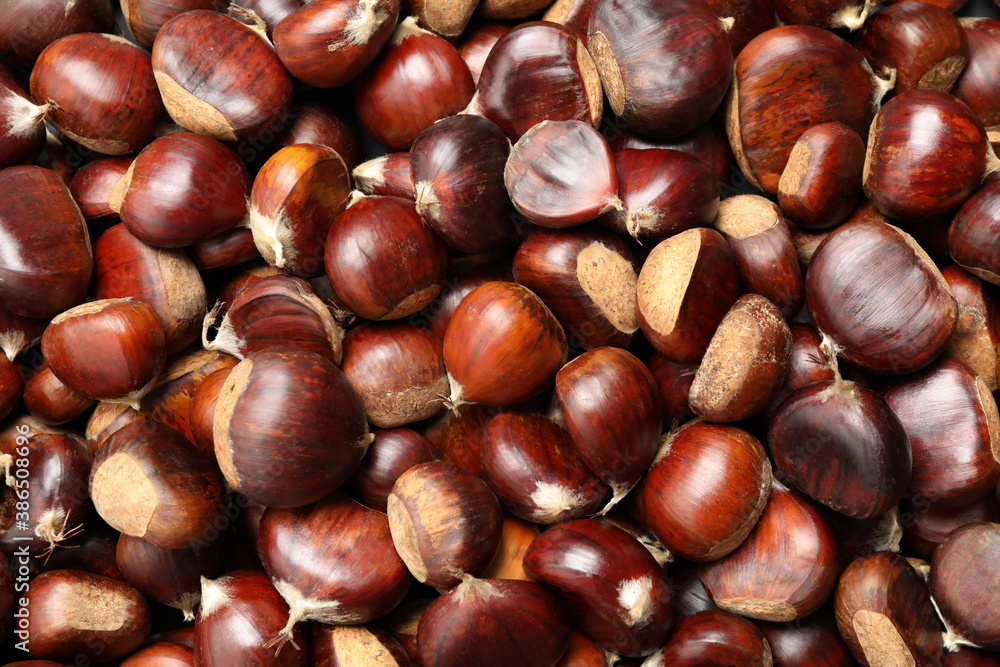 Top view of fresh edible sweet chestnuts as background, closeup Top view of fresh edible sweet chestnuts as background, closeup