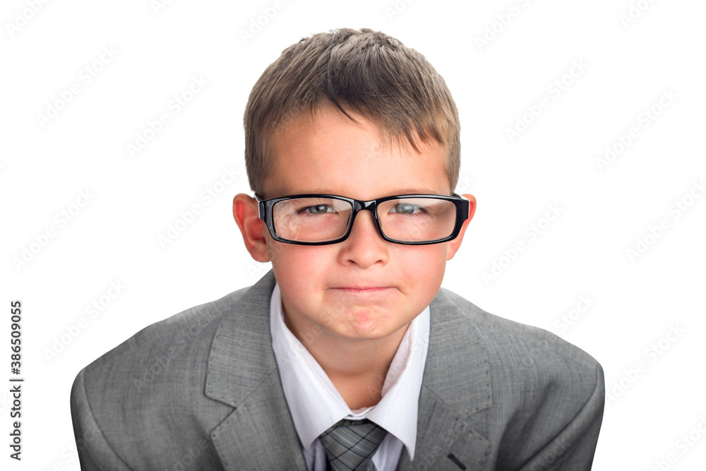 Portrait of a serious child dressed in a business suit and glasses as a businessman. Face of smart boy in glasses and adult suit isolated on white background Portrait of a serious child dressed in a business suit and glasses as a businessman. Face of smart boy in glasses and adult suit isolated on white background