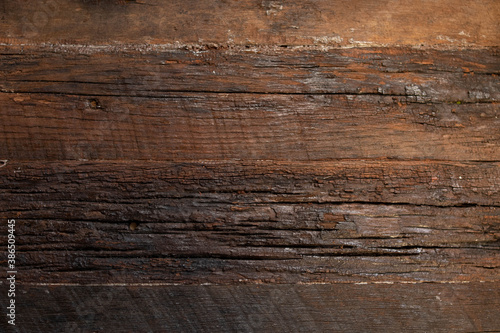 Rustic dark brown wood with saw marks
