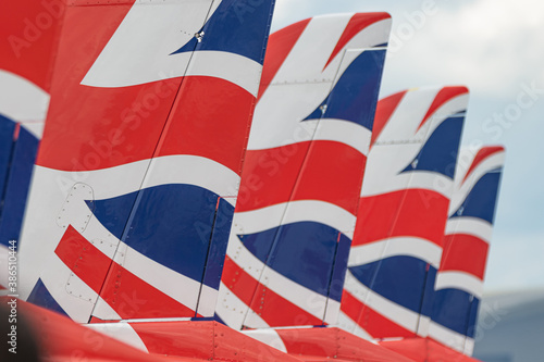 Red arrows tails on ground at airshow 