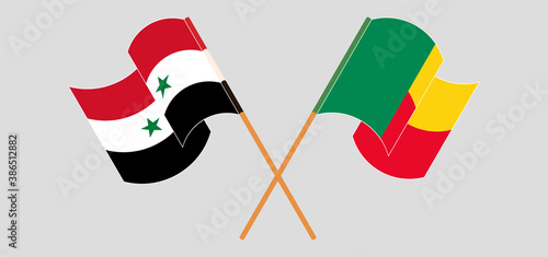 Crossed and waving flags of Benin and Syria