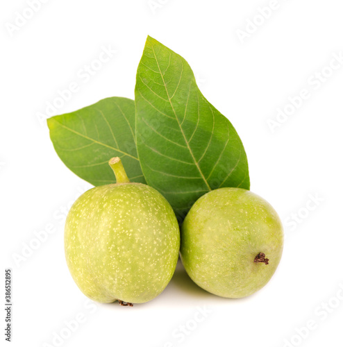 Green walnut, isolated on white background. Peeled walnut and kernels. Walnuts branch.