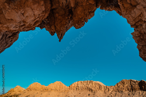 Sky and Mountains through a Fossil Rock. photo