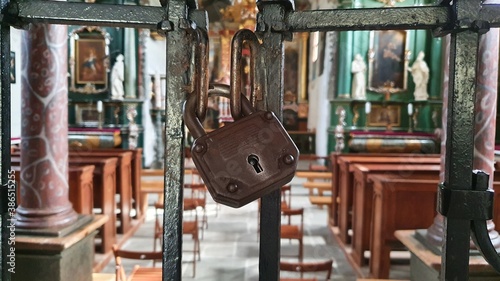 A lock on a church gate.