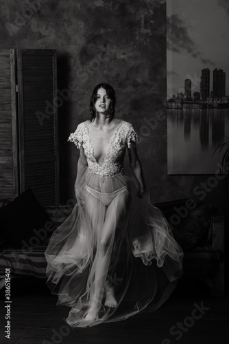 Beautiful bride in white lingerie sitting in her bedroom and studio. © Ivan Zelenin