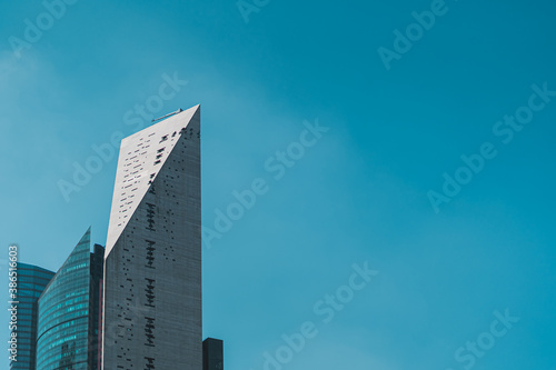 Edificios rascacielos de oficinas ubicados sobre paseo de la reforma en la ciudad de méxico con cielo azul photo