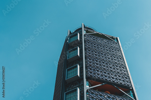 Edificios rascacielos de oficinas ubicados sobre paseo de la reforma en la ciudad de méxico con cielo azul photo