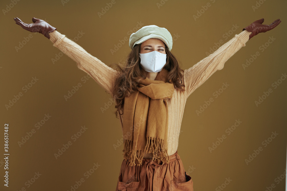happy modern housewife in scarf isolated on beige background