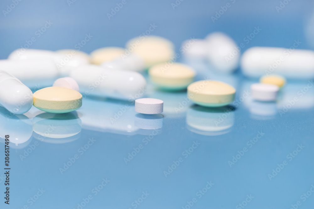 background image of a tablet and pill on the table . background image of a tablet and pill on the table .