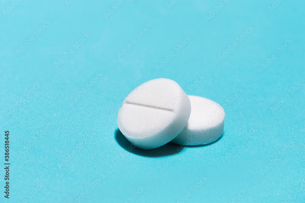 tablets on a blue background. photo with a copy-space. tablets on a blue background. photo with a copy-space.