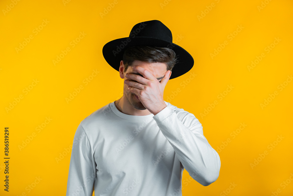 Portrait of young man doing facepalm gesture, like no, I forgot. Unhappy guy feeling sorrow, regret, drama, failure. He isolated on yellow wall Portrait of young man doing facepalm gesture, like no, I forgot. Unhappy guy feeling sorrow, regret, drama, failure. He isolated on yellow wall