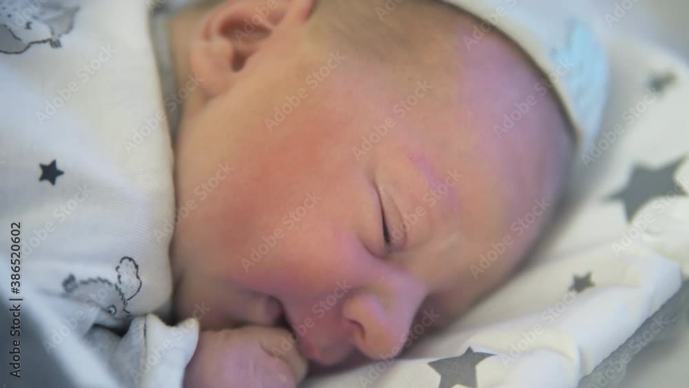 adorable newborn baby trying to lift his little head in the crib. High quality 4k footage adorable newborn baby trying to lift his little head in the crib. High quality 4k footage